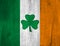 St Patrick`s Day Shamrock Engraved on Wooden Background Stained with Irish Flag Colors