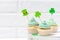 St. Patrick`s Day theme colorful horizontal banner. Cupcakes decorated with green buttercream and craft felt decorations in form