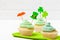 St. Patrick`s Day theme colorful horizontal banner. Cupcakes decorated with green buttercream and craft felt decorations in form