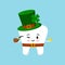 St Patrick tooth in leprechaun costume with gold coin in hand.
