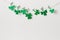 St. Patricks day background with Homemade glitter shamrocks garland