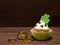 St. Patricks Day Cupcake decorated with Shamrocks and gold coins isolated on Dark Rustic Wood Table and Background with copy space