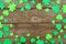St Patricks Day frame of shamrock, top view over an old wood background with copy space
