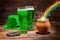 St Patricks day with glasses of green beer, shamrock, leprechaun