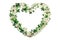 St. Patricks Day lucky Irish heart frame made of spring clover on white background.