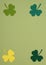 St Patricks Day paper shamrocks frame on green background