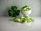 St Patrickâ€™s Day holiday sugar cookies with green and white frosting and sprinkles with four leaf clover shamrocks