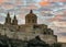 St. Paul`s Cathedral and city walls of fortified town Mdina Rabat on the Mediterranean island of Malta with epic sunset sky,