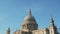 St Pauls Cathedral, a popular London tourist attraction and famous building on a bright blue sky day