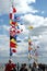 St. Petersburg, Peterhof, Russia - June 2022. Signal marine multi colored flags fluttering on flagpoles adorn the sea pier.