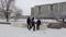 St. Petersburg  Russia 01.10.2021 A group of schoolchildren playing snowballs at a big break near the school