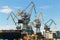 St. Petersburg, Russia - 28 June 2017: port cranes operate on the Neva River in St. Petersburg.