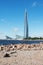 St. Petersburg, Russia - AUGUST 7, 2020: The rocky shore of the Baltic sea and the Lakhta center tower in the Primorsky