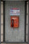 St Petersburg, Russia - Feb. 26, 2016: An old dirty coin and card operated payphone is shown outside along a sidewalk