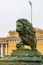 St. Petersburg, Russia, February 2020. Bronze figure of a lion on the background of the Admiralty building.