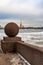 St. Petersburg, Russia, February 2020. A granite ball on the embankment and a view of the Peter and Paul Fortress.