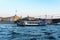 St. Petersburg, Russia, July 2018. A pleasure boat passes under a bridge on the Neva River.