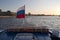 St. Petersburg, Russia, July 2019. Russian flag at the stern of the ship at sunset.