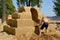 ST. PETERSBURG, RUSSIA. The man begins work on a sandy sculpture