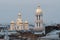 St Petersburg, Russia - Vladimir Cathedral after the restoration of domes on the background of roofs and cloudy sky