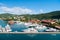 St.Thomas, British virgin island - January 13, 2016: sea port and town on sunny blue sky. Yachts moored at sea pier on mountain la