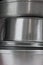Stack of aluminum kitchen utensils close up