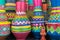 Stack of artistic painted colorful handcrafted pottery vases