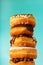 Stack of assorted donuts on blue background