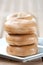 Stack of bagel on white plate