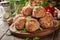 Stack of baked meatballs on a chopping board