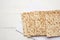 Stack of baked square matzo on a white wooden background