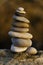 Stack of balanced pebbles in sunset light