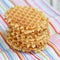 Stack Belgian waffles on a colored tablecloths