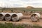 Stack of big frp composite fiberglass plastic sewage pipes at warehouse construction site near Leipzig Halle airport