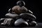 Stack of black stones on black background. Zen and relaxation concepts. Generative AI.