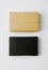 Stack of blank black business cards and craft Cards box on white background. Vertical