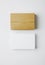 Stack of blank White business cards and craft Cards box on white background. Vertical