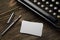 Stack of blank white business cards with typewriter and fountain pen. Mock-up template