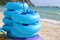 Stack of blue floating rings on the coastline,swim ring, rubber ring, swimming tubes