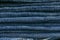 Stack of blue jeans as background