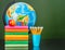 Stack of books with apple, pencils and globe near empty green chalkboard. Space for text