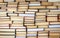 Stack of books education concept background, many books piles