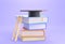 Stack books with ladder and black square academic cap on top isolated on purple background, 3d render. Graduation in