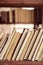 Stack of books on wooden shelf