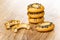 Stack of bread rings sushka with poppy, halves of sushka on wooden table