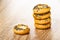 Stack of bread rings sushka with poppy on wooden table