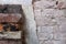 Stack of bricks next to partially removed wall plaster - background