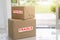 Stack of brown cardboard boxes, fragile box, Fast and reliable service. Delivery and packing concept
