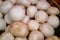 Stack of button mushrooms on a market stall