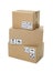 Stack of cardboard boxes with different packaging symbols on background. Parcel delivery